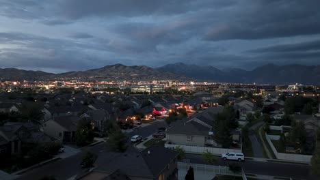 from a residential neighborhood in lehi, utah looking at silicon slopes at nighttime on july 4 2025 - ascending aerial reveal