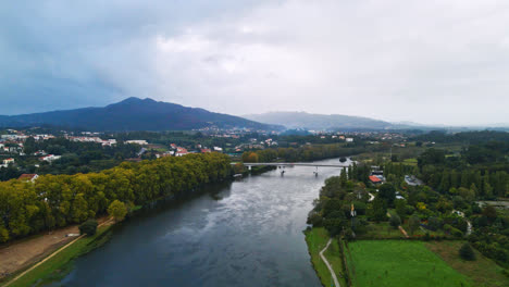 stunning aerial 4k drone footage of a ponte de lima and its river the lima river in portugal