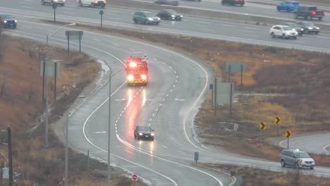 fire truck on a curved highway ramp on a wet day