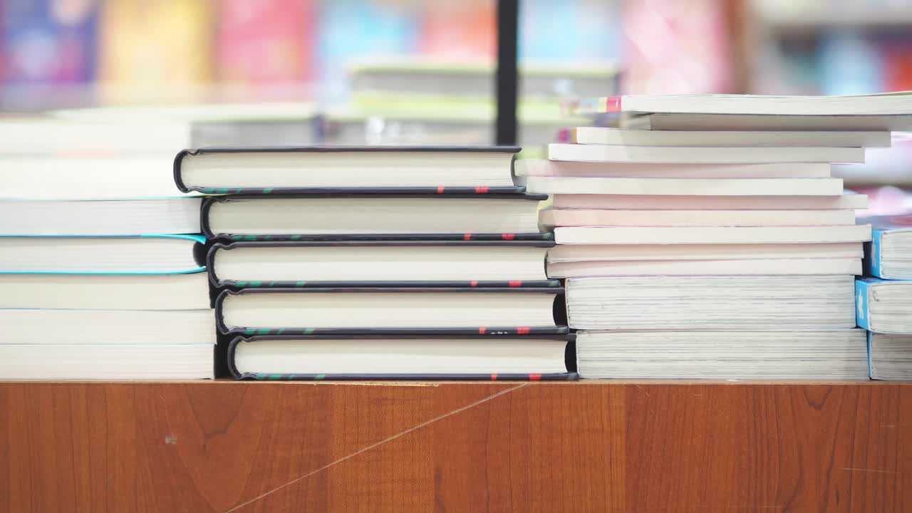 Stacks of Books on a Wooden Table