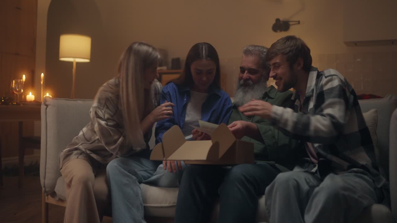 Family opening a box together