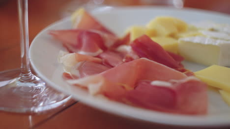 cheese and ham appetizer with wine