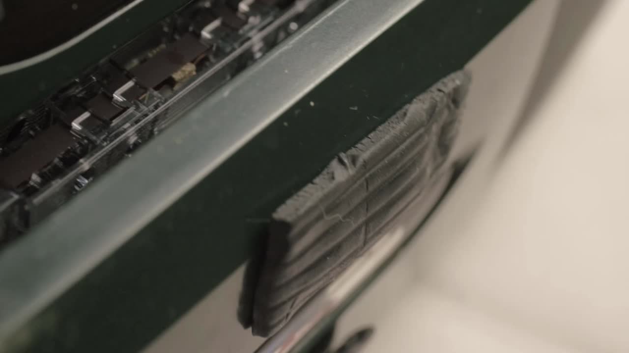Hand ejecting retro cassette tapes into radio cassette player macro