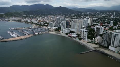 Aerial-Cityscape-of-Santa-Marta-Colombia-Drone-Above-Sea-Downtown-Landscape-Port-and-Tayrona-Natural-Park,-Establishing-Shot