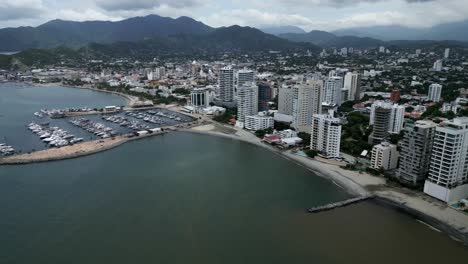 aerial cityscape of santa marta colombia drone above sea downtown landscape port and tayrona natural park, establishing shot