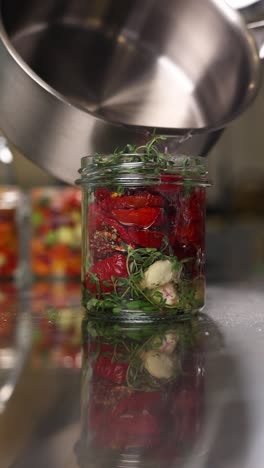 preserving sun-dried tomatoes with herbs