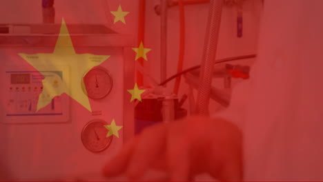 chinese flag animation over laboratory equipment and scientist''s hand