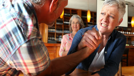 friends playing arm wrestling with each other 4k