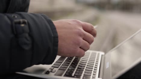 cropped shot of businessman making online purchases from laptop