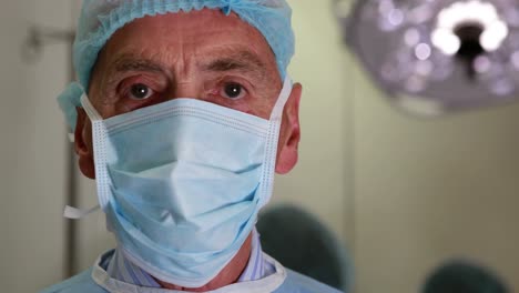 Medical-professor-in-surgical-gear-and-mask