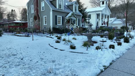 slow aerial tilt up reveal of house decorated for christmas