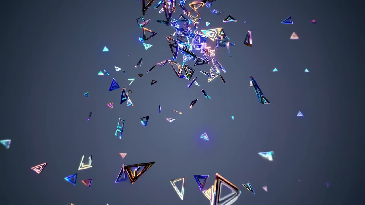 Abstract video of colorful, glowing triangles floating against a dark background