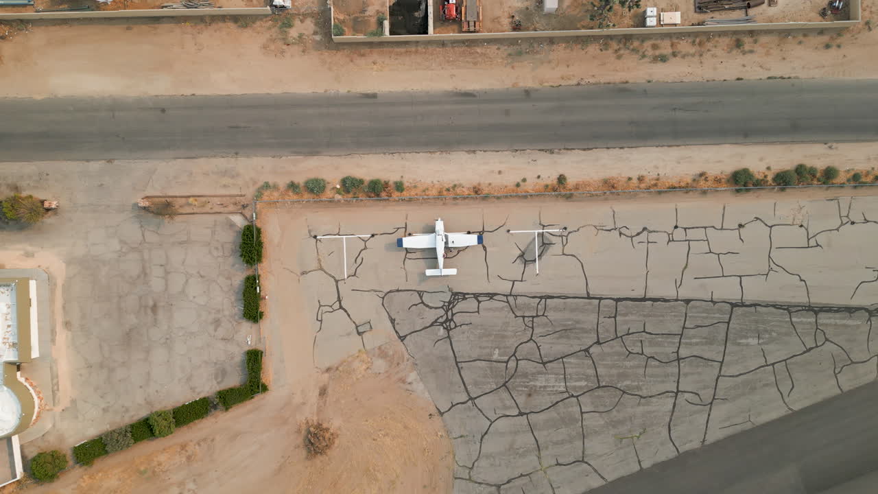 Aerial view of an airplane on an airport runway