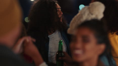 cheerful friends dancing celebrating on rooftop at night enjoying party weekend having fun socializing hanging out drinking young group of people celebrate reunion