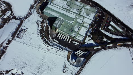 Aerial View of a Warehouse Complex Covered in Snow