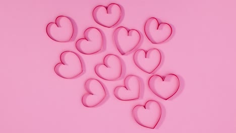 grupo de corazones del día de san valentín se mueven en tema rosa pastel. detenga el movimiento