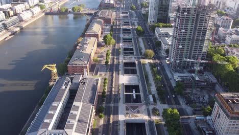 aerial flyover paseo del bajo avenue with traffic at puerto madero area in buenos aires city