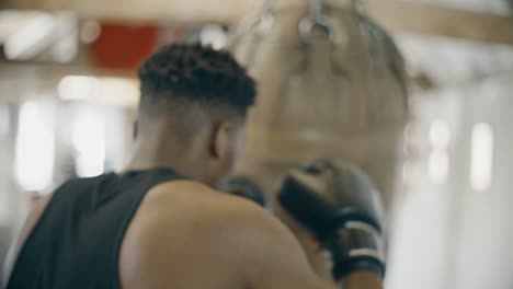 slow motion boxer training with boxing bag