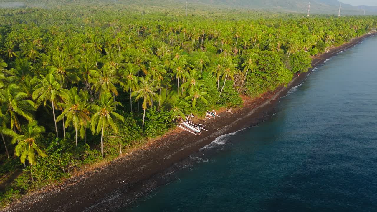 Aerial View Of Gretek Beach In Bali Indonesia, Tropical Seaside Forest And Boat On The Shore
