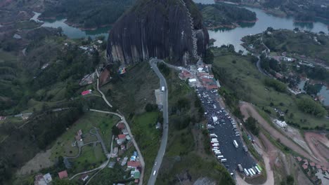 Aerial-tilting-up-on-La-Pietra,-Guatape-during-evening