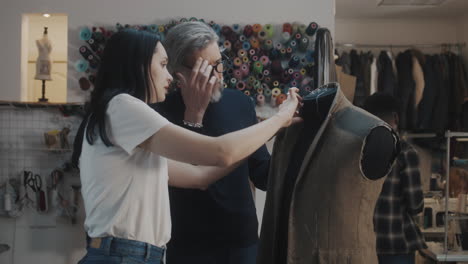 tailor and designer working on a custom jacket