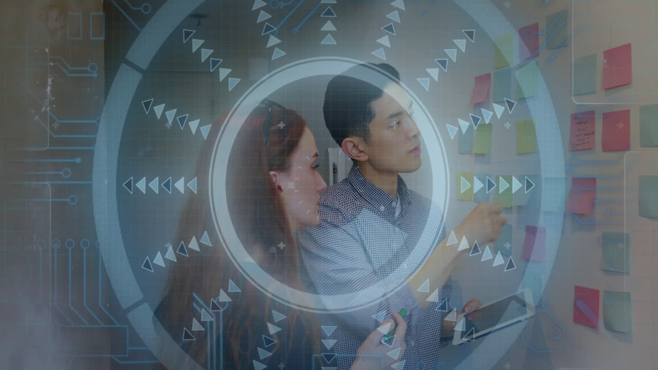 Collaborating on project planning, business professionals using digital interface in office