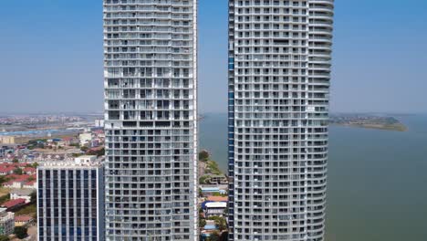 Aerial of modern skyline condominium complex residential buildings on Mekong River, Phnom Penh