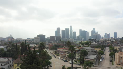 AERIAL:-Echo-Park-Neighbourhood-with-View-on-Downtown-Los-Angeles-on-Cloudy-Day