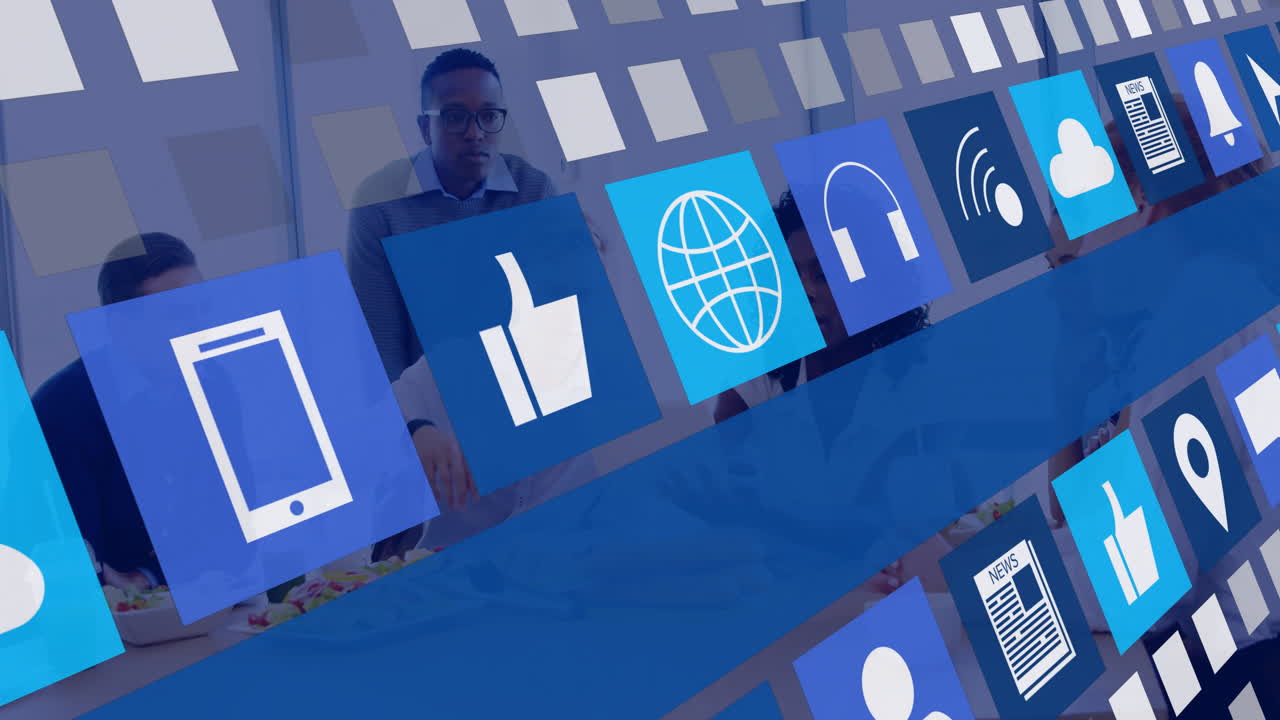 In office, animation of digital icons overlaying people working collaboratively