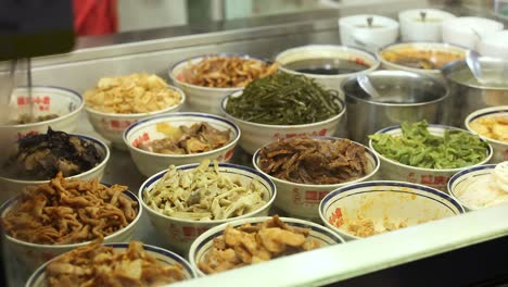 assorted dishes showcased at a food stall