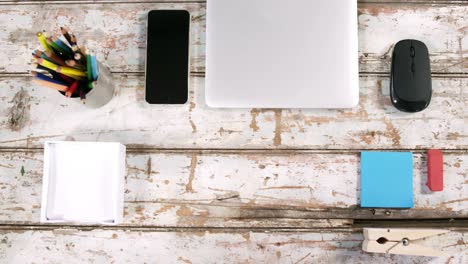 smartphone, mouse, pencil holder, eraser and paper clip