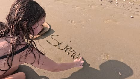 joyful moments unfold as a young girl interacts with the warm sand, using a hat to create captivating shadows on the beach. laughter and adventure fill the sunny atmosphere