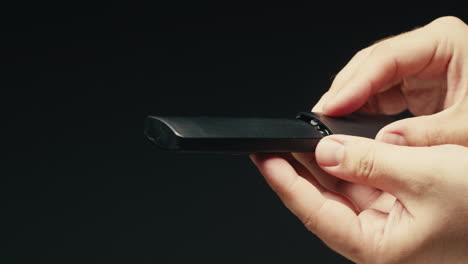 adding silver batteries aa and aaa in remote controller tv close-up. batteries are common in portable electronic devices. an aa battery is composed of a single electrochemical cell that may be either a primary battery or a rechargeable battery. several different chemistries are used in their constru