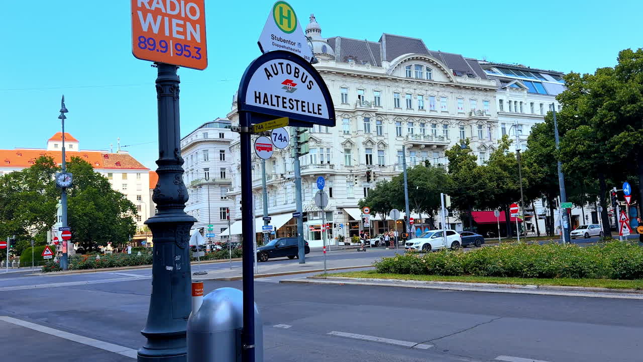 Vienna, Austria - June 9, 2025: Tourists in vibrant Wien street. Tourists enjoy a beautiful day on a busy street in Wien, surrounded by stunning architecture and local shops