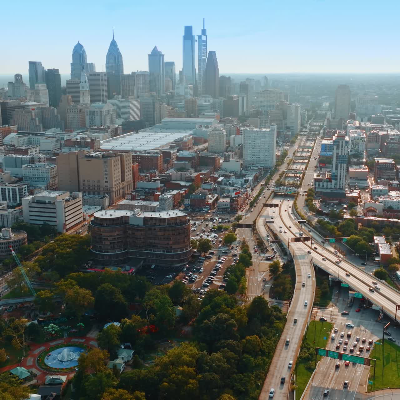 Long highway with transport running by. Urban scenery of Philadelphia, United States. Top view