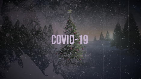 animation of covid-19 text with christmas tree