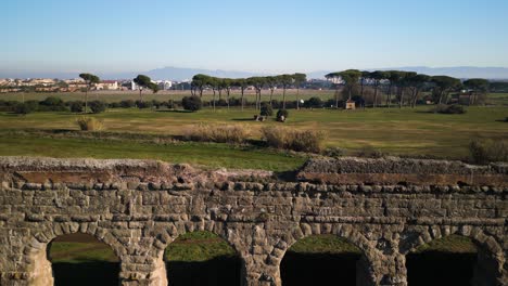 Claudio-Aqueduct-in-Rome,-Italy---Aerial-Boom-Shot-on-Typical-Day