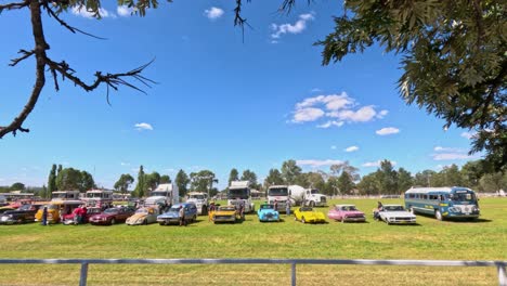 panoramic view of a colorful vintage car show