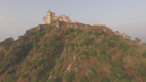 a slow revealing crane-like shot of the 15th century hill fort of kumbhalgarh in rajasthan