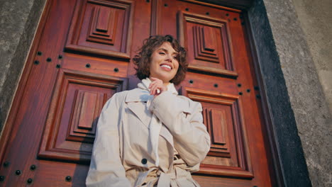 charming lady leaning door vintage building enjoying weekend leisure closeup.