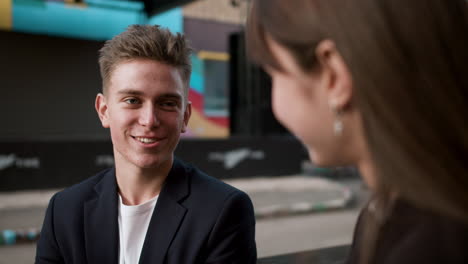 teenage boy talking to girl