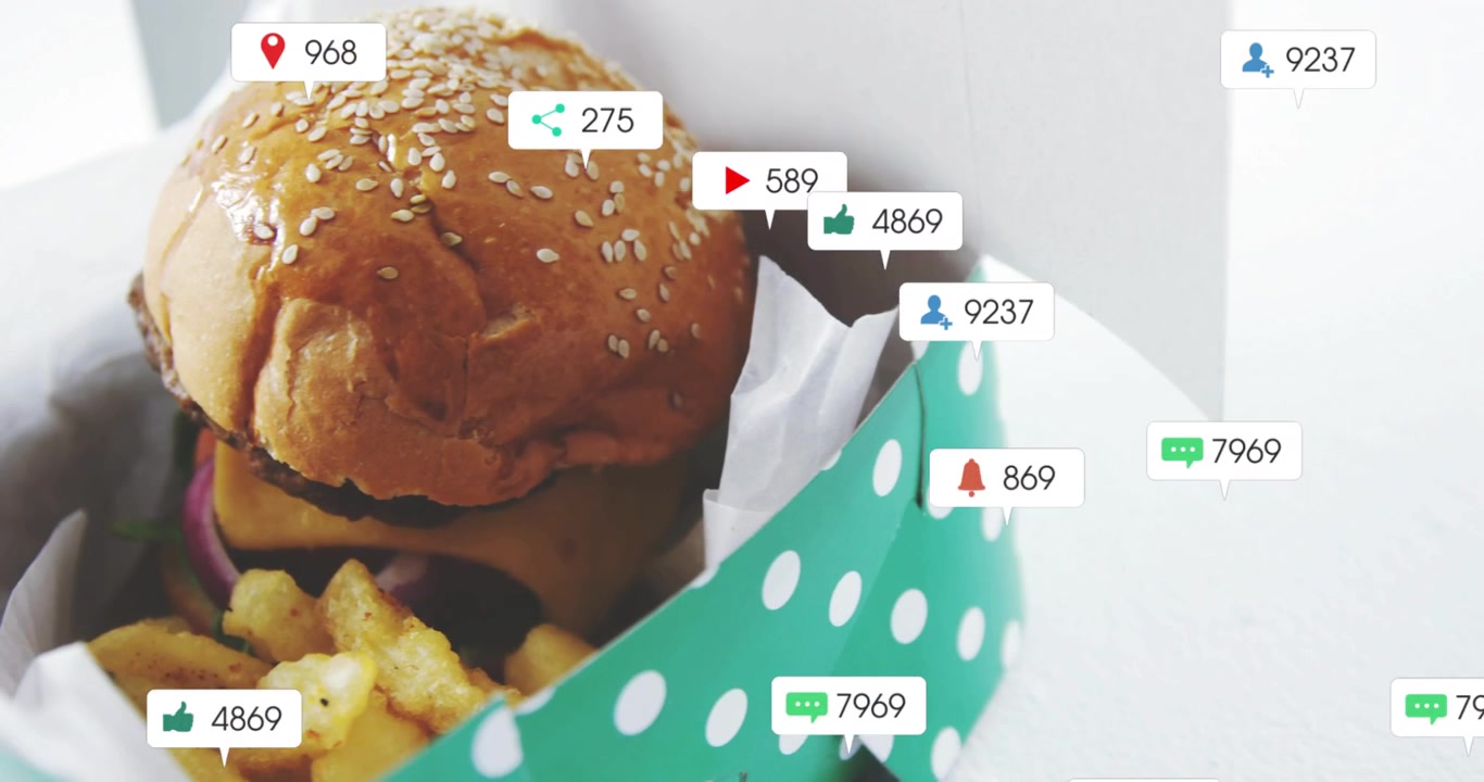 Hamburger and Fries in Takeout Box with Social Media Notifications