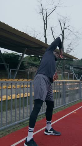 man stretching outside