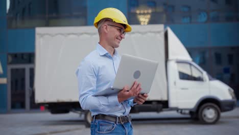 business. engineer worker protective helmet use laptop controls working process inspector supervisor yellow hard hat glasses transportation company