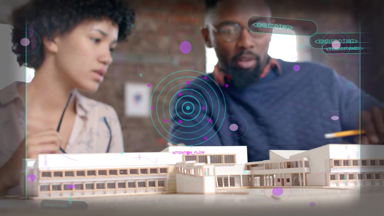 Man donning headphones and speaking activating AR while woman assembling model for design review