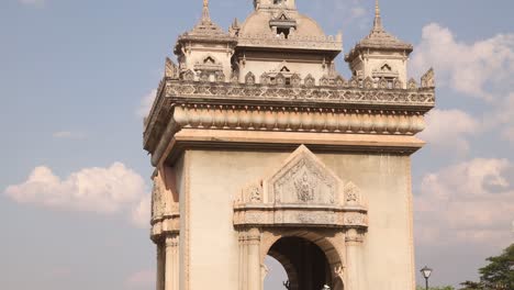 Blue-sky-and-clouds-behind-the-Patuxai-Victory-Monument-in-the-center-of-Vientiane,-Laos