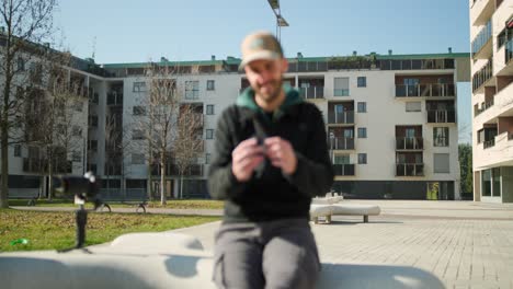 filmmaker pulling focus using a wireless follow focus system connected to his camera rig