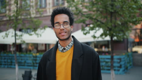 smiling man in a city street