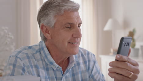 happy-mature-man-having-video-chat-using-smartphone-grandfather-enjoying-conversation-with-family-sharing-lifestyle-chatting-on-mobile-phone-relaxing-at-home-4k