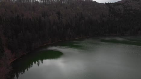 aerial view of sfanta ana lake in romania, volcanic lake with beautiful green water